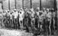 Soviet prisoners of war standing before barracks in Mauthausen Concentration Camp, Austria, black-and-white photograph, date unknown [ca. 1941–1945], unknown photographer; source: Deutsches Bundesarchiv (German Federal Archive), Bild 192-208, Wikimedia Commons, http://commons.wikimedia.org/wiki/File:Bundesarchiv_Bild_192-208,_KZ_Mauthausen,_Sowjetische_Kriegsgefangene.jpg?uselang=de.Creative Commons Attribution-Share Alike 3.0 Germany license. 