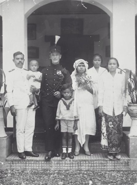 Wedding portrait of a K.N.I.L. sergeant and his Indian bride, black and white photograph, between 1915 and 1925, unknown photographer; source: Tropenmuseum of the Royal Tropical Institute (KIT) Amsterdam, wikimedia commons, http://commons.wikimedia.org/wiki/File:COLLECTIE_TROPENMUSEUM_Het_huwelijk_van_een_KNIL-sergeant_met_een_Indische_vrouw_TMnr_60042047.jpg  Creative Commons Attribution-Share Alike 3.0 Unported license.