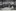 "Auswanderer vor dem Comitè des Hilfsvereins der Deutschen Juden in Hamburg [in den Auswandererhallen der Hamburg-Amerika Linie]", unbekannter Photograph, 1907; Bildquelle: Sechster Geschäftsbericht des Hilfsvereins der Deutschen Juden (1907), Berlin 1908, S. 112.